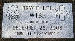 gray Granite Gravestone for an Infant with a Teddy Bear and Airplane emblems
